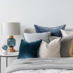 Bedroom interior with pillows and a lamp on the bedside table isolated on white background --no shadow, text, logo Job ID: f0e44e8a-6cc2-4ea1-9ed5-b373287c366e